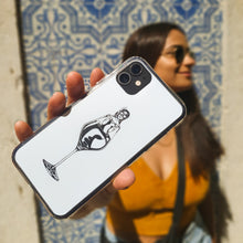 Load image into Gallery viewer, Yasmin de Paiva holding a designer case with a woman in a glass