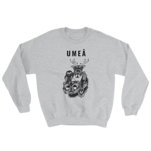 Grey sweater with the Umeå design of a reindeer, an owl, a bear and a wolf gathered around Nydala lake.