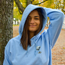 Load image into Gallery viewer, Brazilian female model wearing a blue hoodie in Bonn Germany