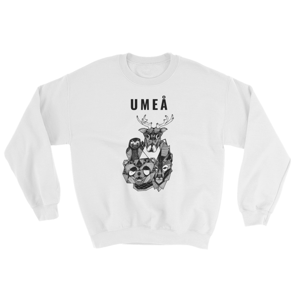 White sweater with the Umeå design of a reindeer, an owl, a bear and a wolf gathered around Nydala lake. Original artwork by Jonn Designs.
